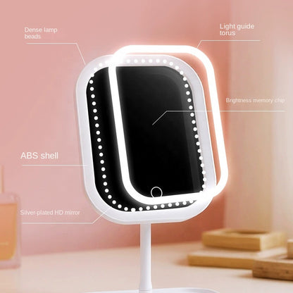 White LED makeup mirror with warm glow lighting, styled on a storage tray base with lipstick and skincare products reflected in the mirror